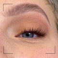 Close-up of a person's eye with false eyelashes