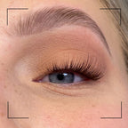 Close-up of a person's eye with false eyelashes